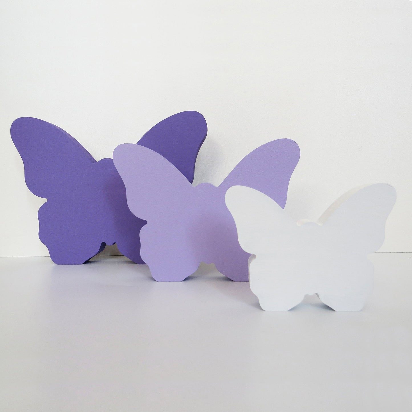 Set of three freestanding butterfly ornaments for a childrens nursery, playroom or bedroom.