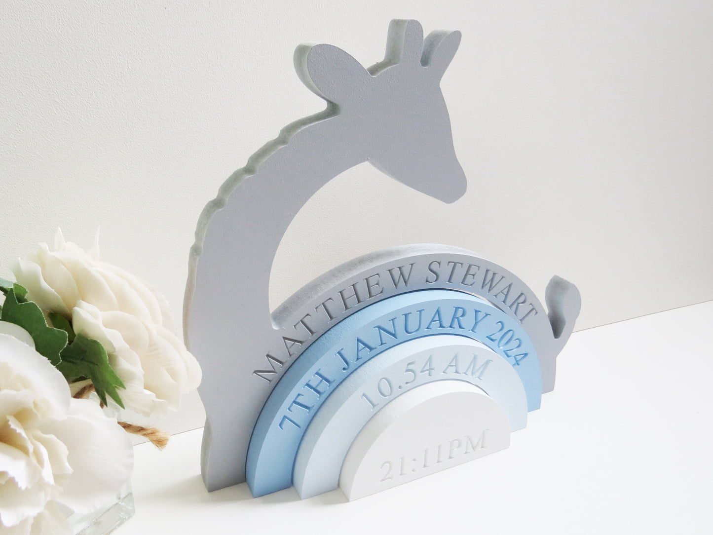 a childrens fully engraved Giraffe Rainbow Shelfie Stacker painted grey and shades of blue. perfect for any nursery, bedroom or playroom.