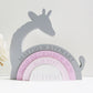 A childrens fully engraved Giraffe Rainbow Shelfie Stacker painted grey and shades of pink. perfect for any nursery, bedroom or playroom.