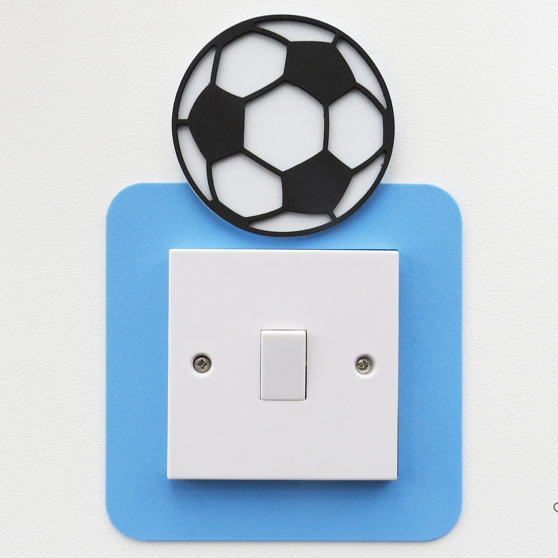 blue craft foam light switch surround designed with a black and white football