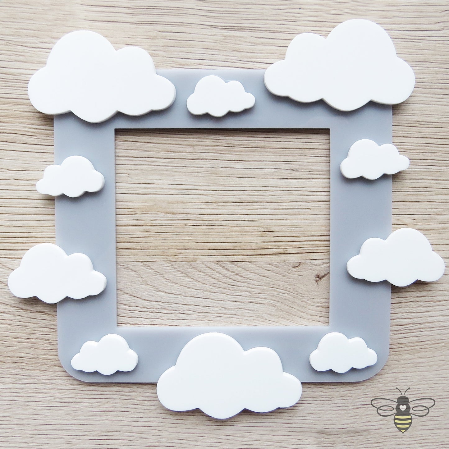 A kids bedroom acrylic light surround decoratedwith clouds.