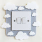 A kids bedroom acrylic light surround decoratedwith clouds.