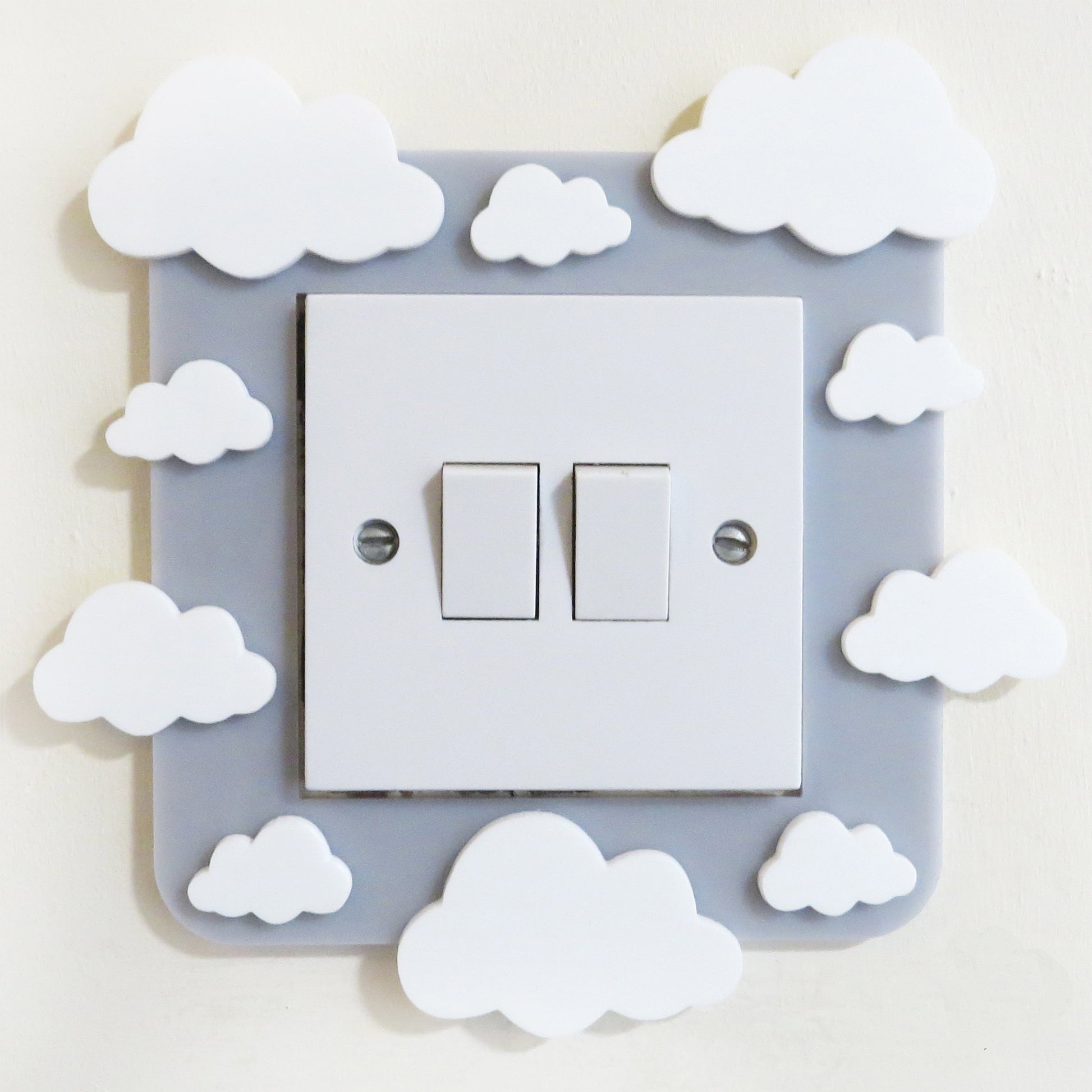 A kids bedroom acrylic light surround decoratedwith clouds.