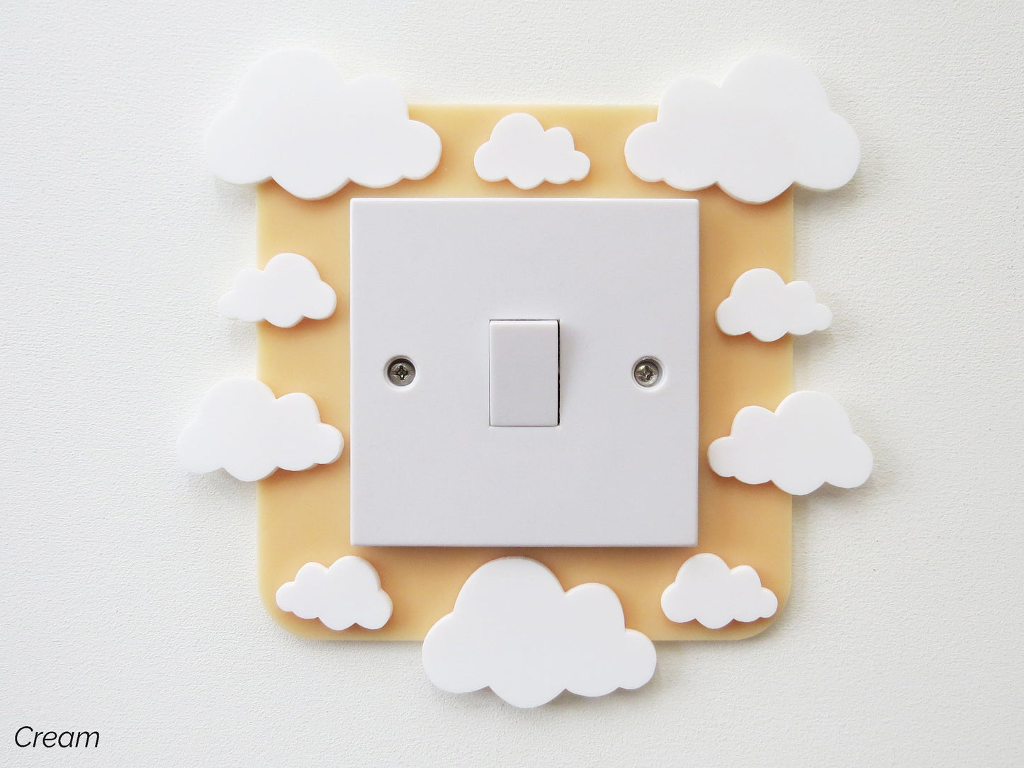 A kids bedroom acrylic light surround decoratedwith clouds.