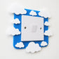 A kids bedroom acrylic light surround decoratedwith clouds.