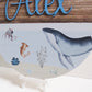 A printed plaque with an under the sea whale printed design. Perfect for any nursery or kids bedroom decor.