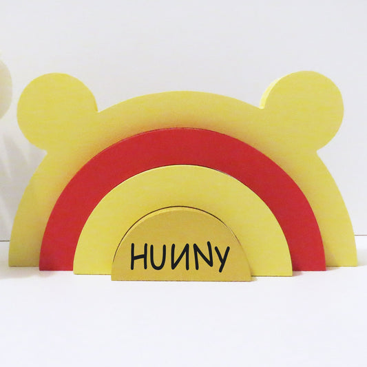Bear shaped rainbow stacker painted in Winnie The Pooh colours.