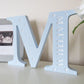 Childrens nursery freestanding letter with engraved name and stars.