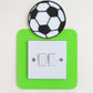Green craft foam light switch surround designed with a black and white football