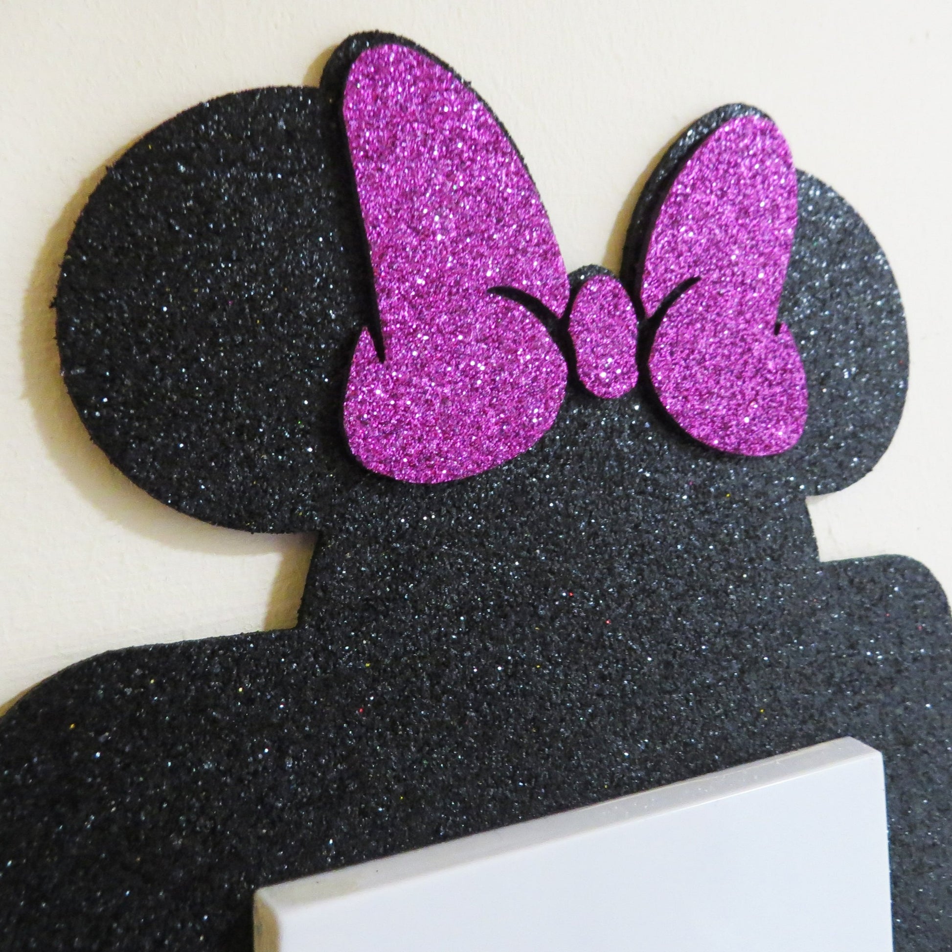Disney Minnie Mouse shaped light switch surround.
