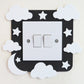 Black craft foam light switch surround designed with clouds, stars  and a moon.