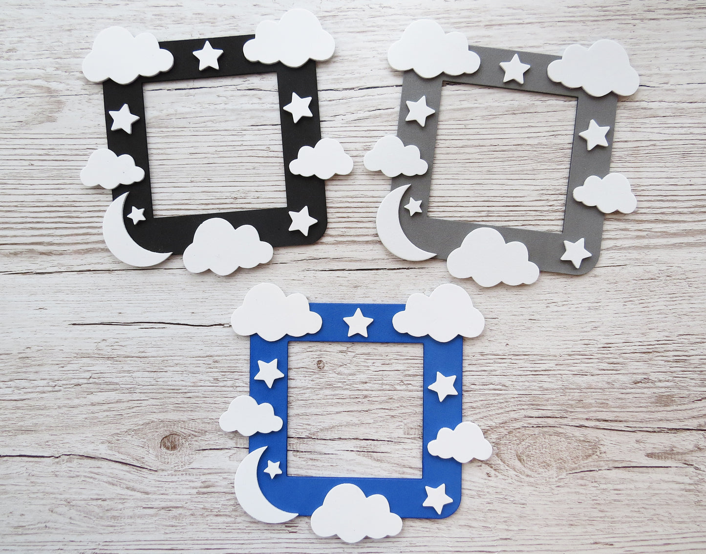 Craft foam light switch surround designed with clouds, stars  and a moon.