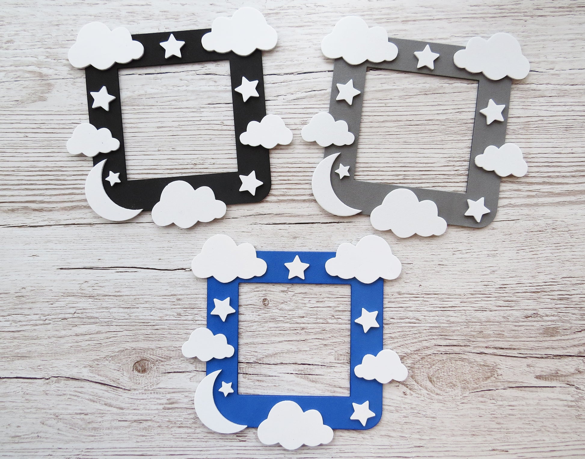Craft foam light switch surround designed with clouds, stars  and a moon.