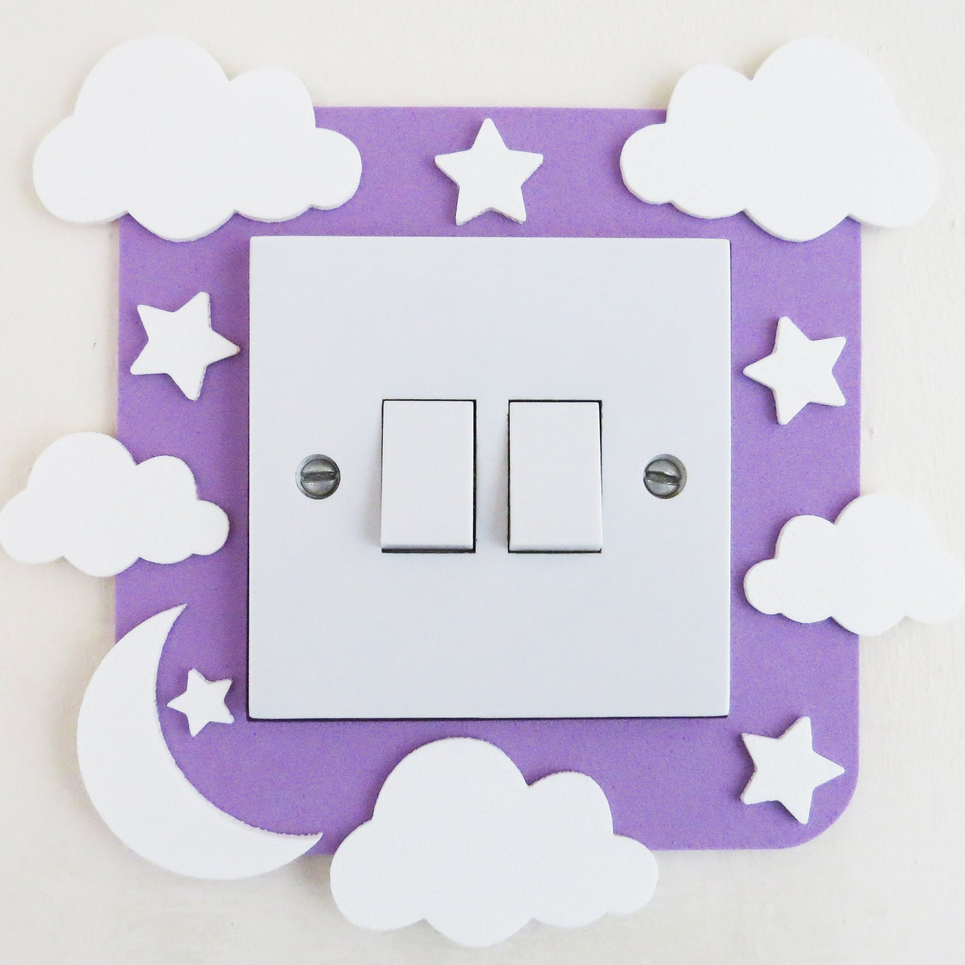 Craft foam light switch surround designed with clouds, stars and a moon.